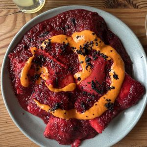 mushroom & tofu agnolotti in beet arrabiatta w/ chili sauce from Feral  at Feral in Portland