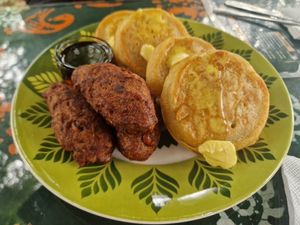 Delicious fluffy pancakes, syrup and bean sausages which were more like croquettes at Inity in Aburi