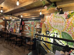 Upstairs seating above kitchen in covered market   at Green Choy - Tooting in South West London