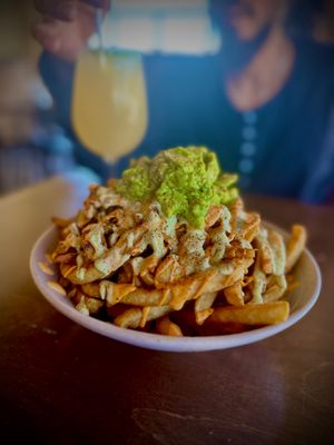 I usually get the nachos because they are the best.. these are the loaded fries they are seasoned and saucy 💕 at PlanTita's Kitchen in Long Beach