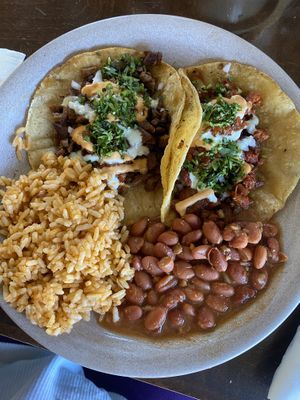 Asada taco and al pastor taco (2 taco plate served with rice and beans)  at PlanTita's Kitchen in Long Beach