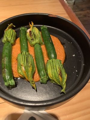 Zucchini flowers filled with tofu and coconut on a bed of romanesco sauce  at Rasoterra in Barcelona