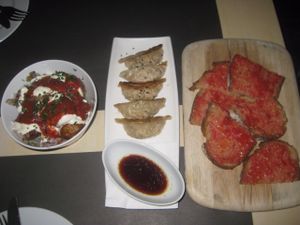 Vegan tapas:  patatas, gyoza, tomato bread at Rasoterra in Barcelona