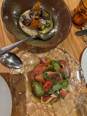 Our starters: Pumpking with pea purée and tomato fig saladd  at Rasoterra in Barcelona