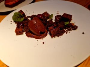 Preserved CHERRIES, home-made chocolate and cardamom ice-cream, grounds’ crumble and sponge, ron caramel (gf) at Rasoterra in Barcelona