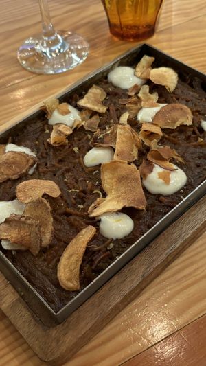 FIDEUÀ (baked like paella but made with broken noodles), Jerusalem artichoke chips, piparra pepper allioli  at Rasoterra in Barcelona