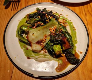 Saltat verd de temporada, cremes de FAJOL i bròquil, caramel de tamari i garum at Rasoterra in Barcelona