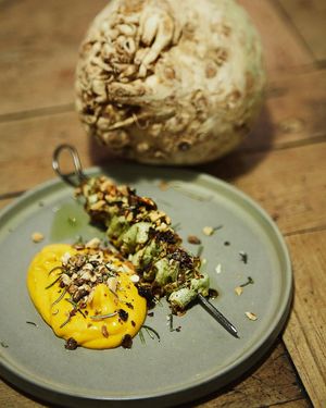 Celeriac skewer, turmeric cream, aromatic herbs at Rasoterra in Barcelona