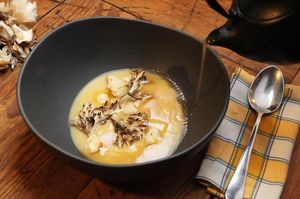 Potato parmentier, maitake, and mushroom broth at Rasoterra in Barcelona