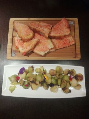 Seasonal brussel sprouts with home made bread and fresh tomatos at Rasoterra in Barcelona