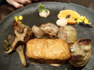 Marinated artichokes, pumpkin and horn of plenty mushroom spongy cake at Rasoterra in Barcelona