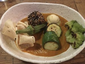 Third dish: curry with glutinous rice, papadum and veggies at Rasoterra in Barcelona