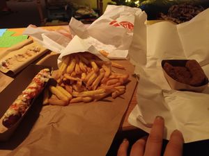 Take out fries with avocado bites and vegan frikandel special at Pepas Vegan Frituur in Leuven