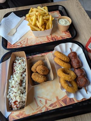 small fries with homemade tartar sauce, frikandel speciaal, forest mushroom croquettes, cheezz rings & grizzly (batter-fried meatball & onion saté) at Pepas Vegan Frituur in Leuven
