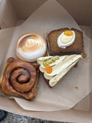 Caramel apple sticky bun, pistachio olive cake, lemon tart, and lemon almond oil cake.   at Orange & Blossom Patisserie in Portland