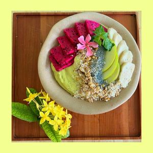 Green Smoothie Bowl: Mixed frozen mango, avocado, spinach and coconut milk. Topped with dragon fruit, apple, banana, Khmer granola, chia seeds and mint. at Cambodhi in Kampot