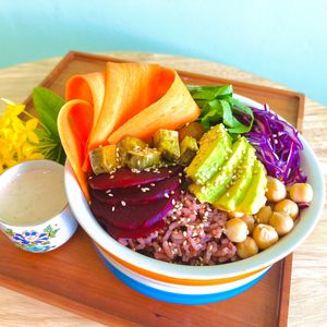 Bodhi Bowl:
Chickpeas, red rice, cabbage, sweet potato, carrots, tofu, avocado, beetroot tomatoes and spinach combined within a delicious bowl. Served with our tahini lime sauce. at Cambodhi in Kampot