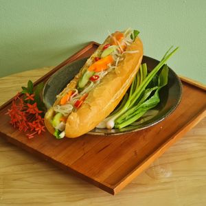 Nom Pang: Paté
A Cambodian street food classic! A crispy baguette with pickles, vegan paté, our signature plant-based fish & tofu sauce and herbs. at Cambodhi in Kampot