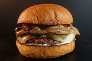 Impossible patty with creamy sautéed mushrooms, mozzarella cheese, and mayo. Served with fries on the side.
 at Nabati Bistro in Dubai