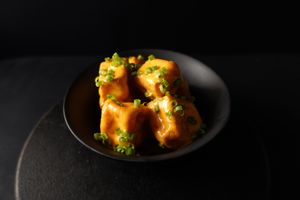 Dynamite Tofu Puffs - Deep fried tofu bites in dynamite sauce.
 at Nabati Bistro in Dubai