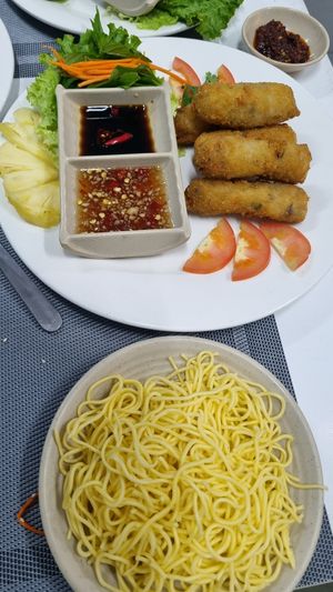 Spring rolls was served with noodles on the side at An Nhi Chay in Hue