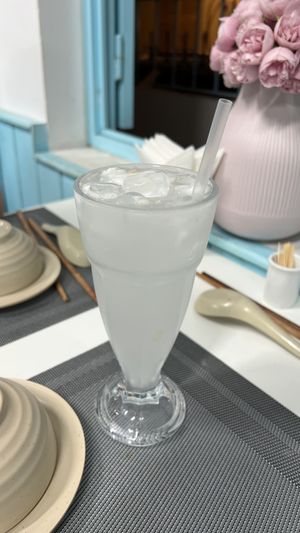 Coconut water with coconut junks and ice - so refreshing   at An Nhi Chay in Hue