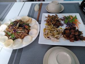 banana blossom salad (left) and mushrooms with passionfruit sauce (right) at An Nhi Chay in Hue
