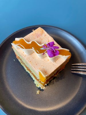 "STONEWAY SUMMER":
Orange olive oil sponge, apricot jam, almond-praline buttercream filling, li hing mui buttercream frosting. at Paper Cake Shop in Seattle