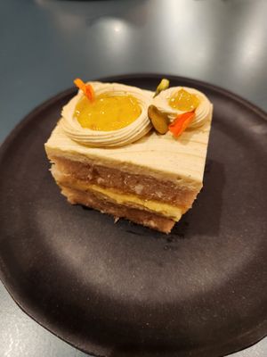 Cardi P: coconut sponge, pistachio cardamom buttercream, Yuja marmalade, pistachios at Paper Cake Shop in Seattle