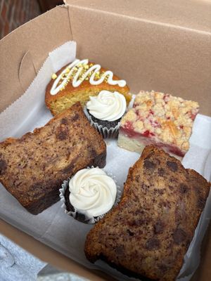 Orange pistachio olive oil cake, strawberry crumb cake, chocolate chip banana bread, and two mini vanilla frosted chocolate cupcakes. All incredible! at Maple & Maine Pastry Kitchen in Boston
