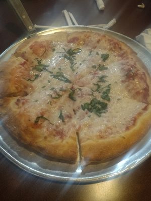 Add basil at Zio's Pizzeria  in Omaha