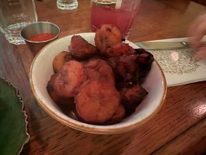 Fried plantain with spicy tomato sauce  at Jungle Palace Restaurant - Ephemera in Paris