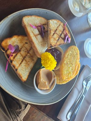 Sourdough toast with jam and peanut butter, a side of hashbrowns at Osprey's Restaurant in Oak Beach