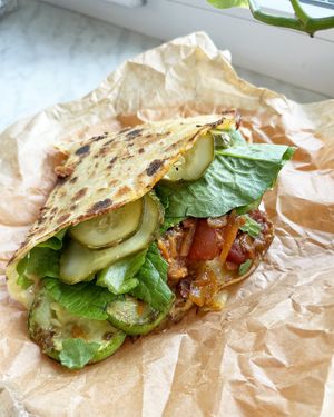 Sattwich: grilled zucchini, eggplant stew, baked bell peppers, baked beans, pickles, vegan cheese sauce, wrapped in a homemade freshly baked flatbread at Internet Cafe in Yerevan