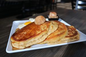 🥞Pumpkin Spice Pancakes pan fried pumpkin purée hotcakes with a crisp golden brown exterior. Topped with pumpkin spice brown sugar butter drizzled with maple syrup at Sacy's in Brimley