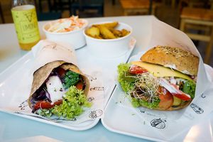 Seitan Pastrami Wrap with vegan feta; Burger with tofu and vegan cheese at Krowarzywa - Hoza in Warsaw