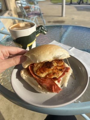 The ‘Peter Dinklage’ vegan egg and bacon roll with tomato sauce. Piping hot soy flat white    at The Cove in Lakes Entrance