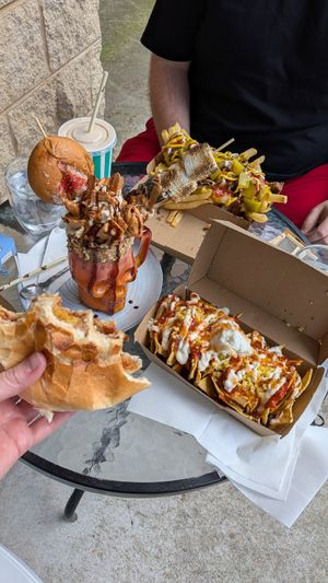 Egg and bacon roll, nachos, loaded fries and the freakshake. at The Cove in Lakes Entrance