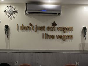 Wall decor that always makes vegans smile!  at Veganapati in Lisbon