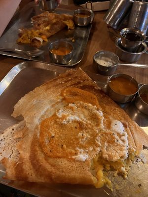 Masala dosa with a bite out of it... Ginger tea on the right.  at Anantha Bhavan Inn in Fort Kochi