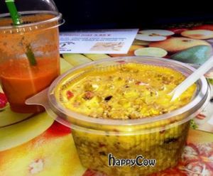 muesli bowl with fresh orange juice in the small take away downstairs at Veg Life - Stare Mesto in Bratislava