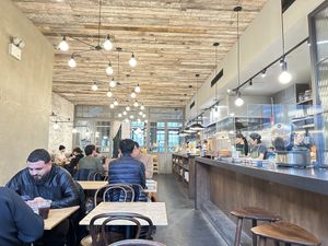 Interior of cafe - order at counter in front room, for dine in you receive a buzzer that alerts you when your food is ready. Pick up at counter.   at ACRE in Brooklyn