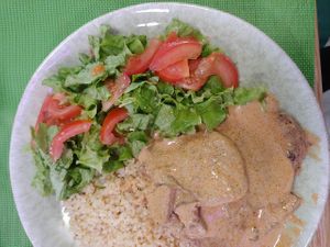 Seitan with mustard sauce, bulgur wheat and salad at SHANTI - Cantina Vegan in Marinha Grande