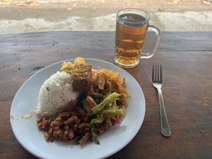 Free hot tea with your meal. I added a Tempeh cube to four different vegetable dishes.    at Warung Nasi Tin's in Cijulang