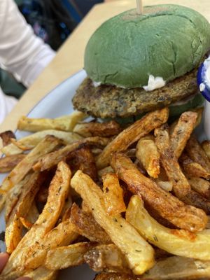 Homemade burger with spinach bun and vegan tartar sauce.  at Skapto  in Sofia