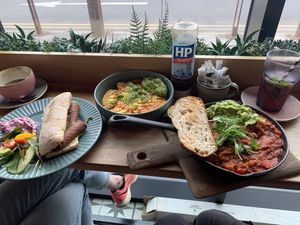 Ciabatta with vegan sausage, avo, sriracha + topped hash browns with vegan cheese + shakshuka    at Lyla Belle's Cafe in Hartlepool