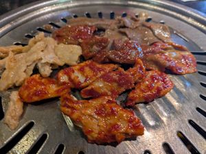 Assorted meats on the table grill at Master Kim's Korean BBQ 2 in Las Vegas