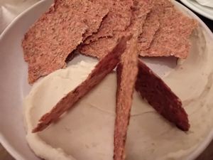 Kimchi crackers with white bean hummus at Bar Avelo in Toronto