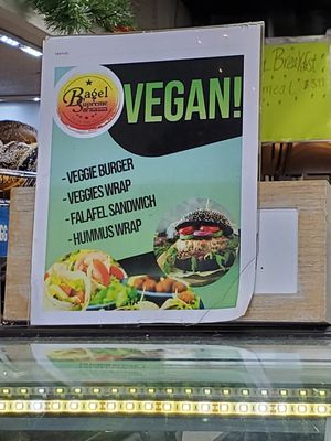 sign inside advertising vegan options at Bagel Supreme of Oakland in Oakland