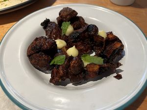 crispy sunchokes with lemon curd and dates  at Bluto's in Portland